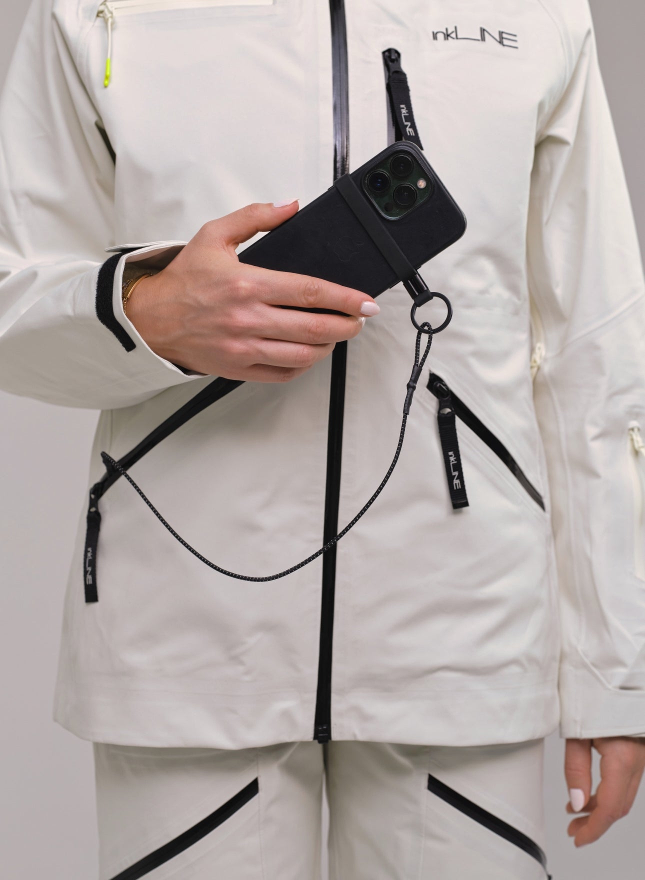 womens cream ski jacket with phone leash- InkLine